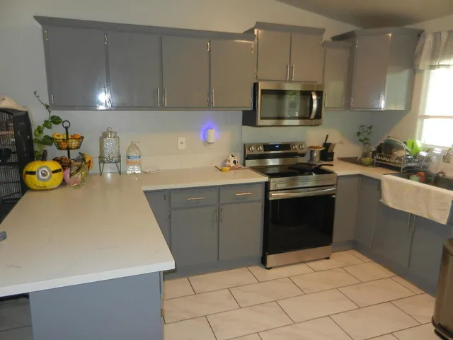 a kitchen with a sink and cabinets
