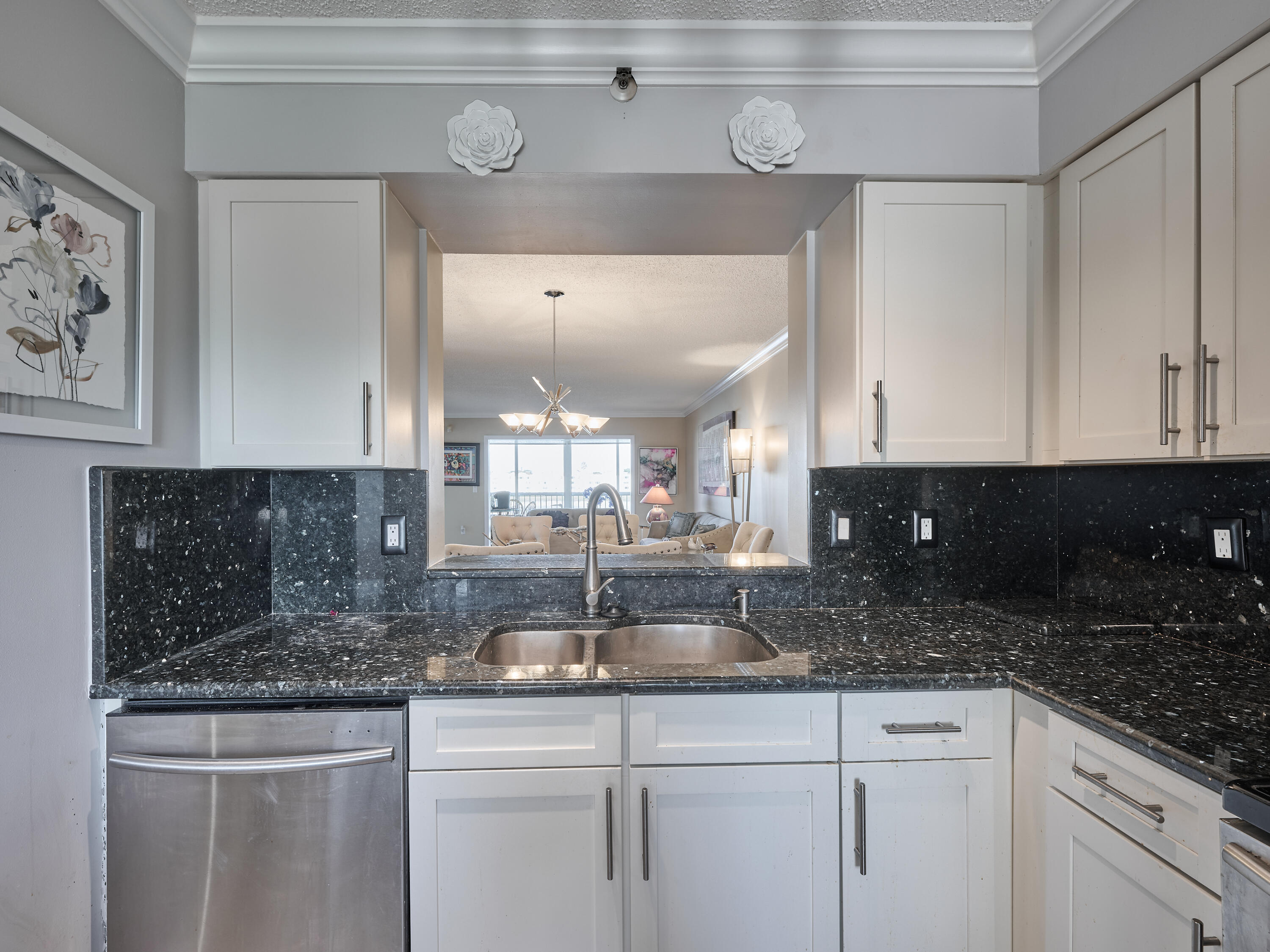 14112 Huntington Pointe Drive, Unit 401 Delray Beach, FL 33484 - Photo 13 of 49 a kitchen with a sink and cabinets