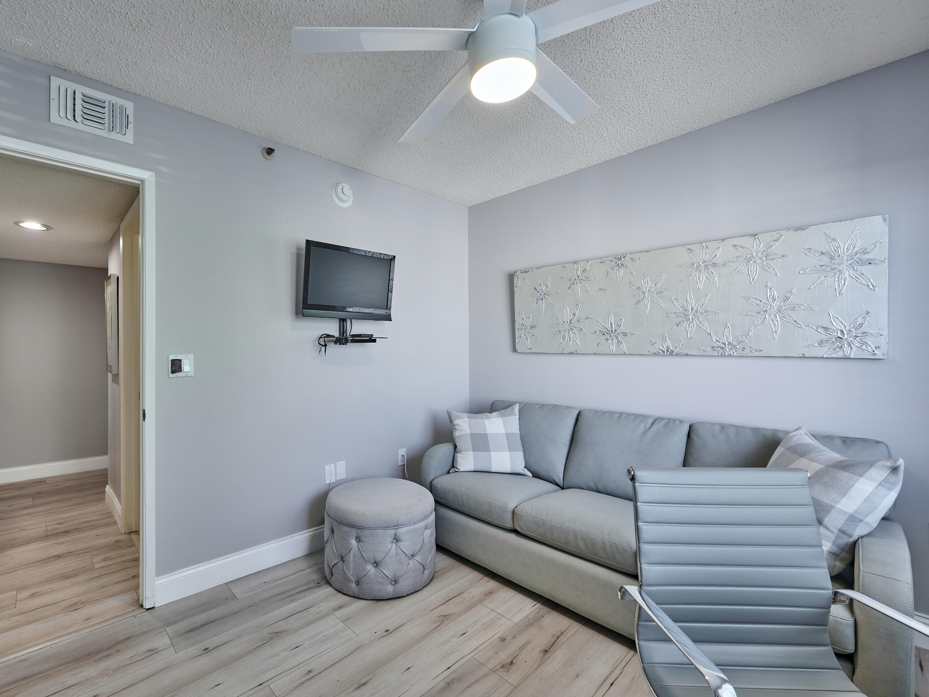 14112 Huntington Pointe Drive, Unit 401 Delray Beach, FL 33484 - Photo 20 of 49 a living room with furniture and a flat screen tv