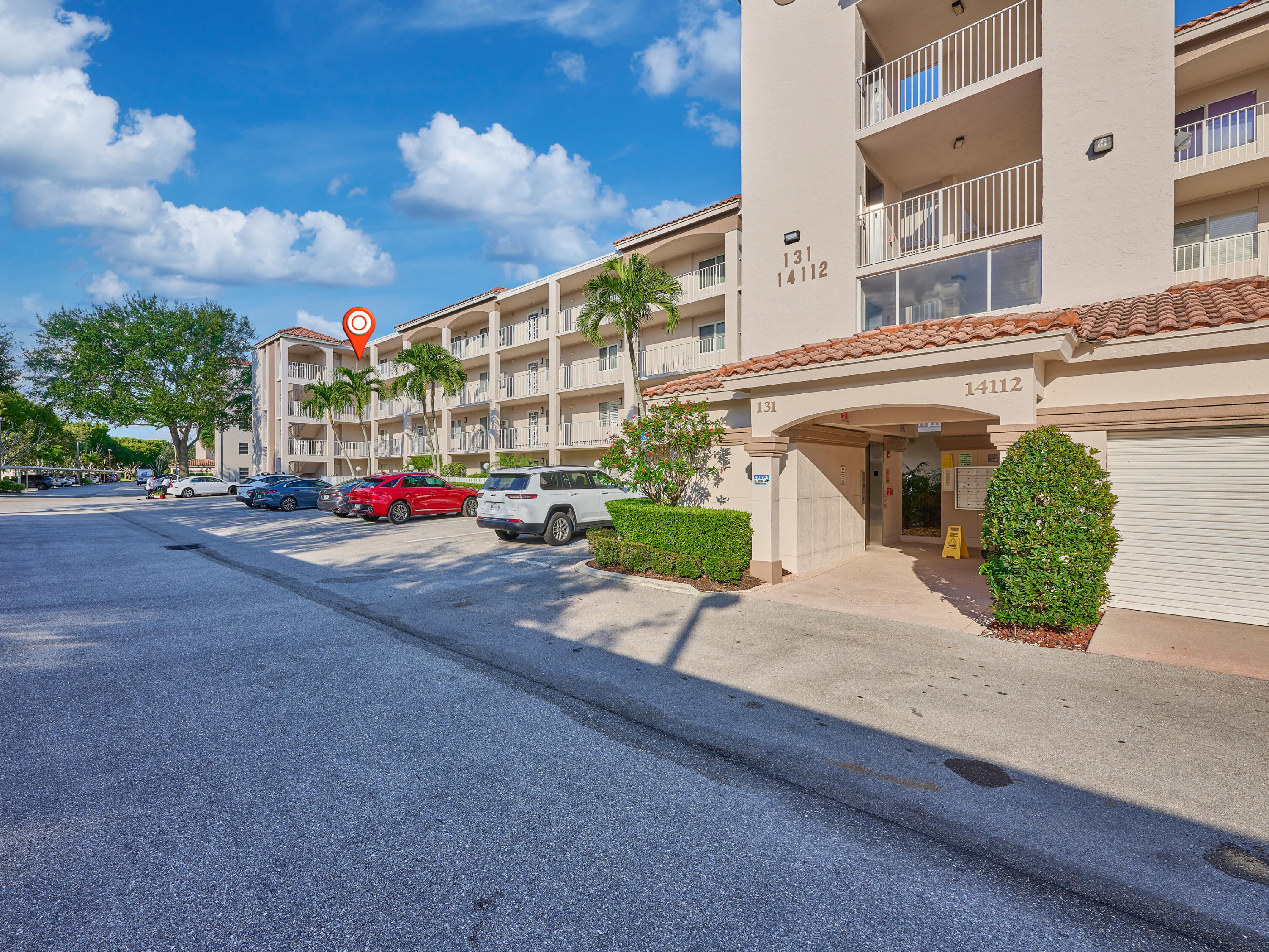 14112 Huntington Pointe Drive, Unit 401 Delray Beach, FL 33484 - Photo 2 of 49 a view of the street with buildings