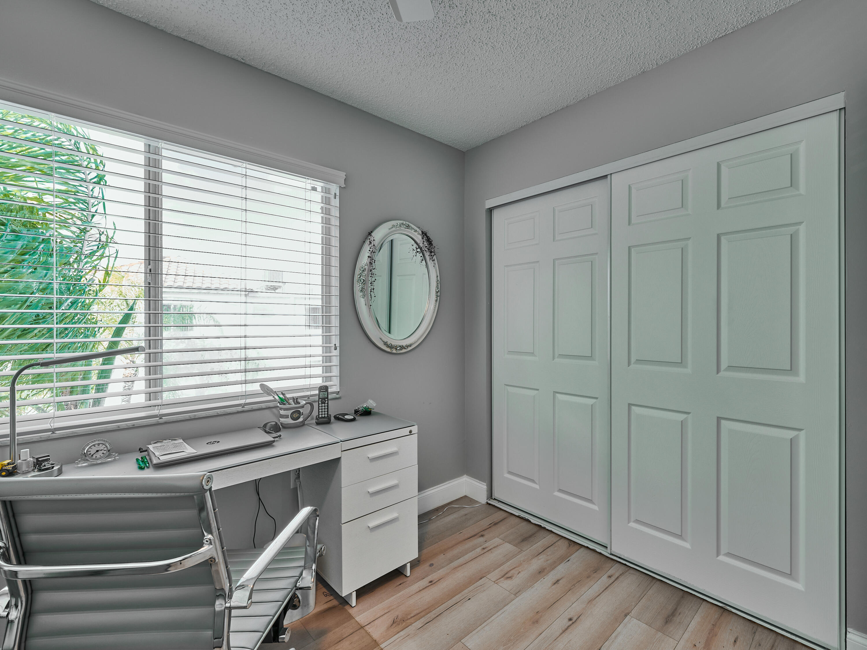 14112 Huntington Pointe Drive, Unit 401 Delray Beach, FL 33484 - Photo 21 of 49 a room with a mirror and a window