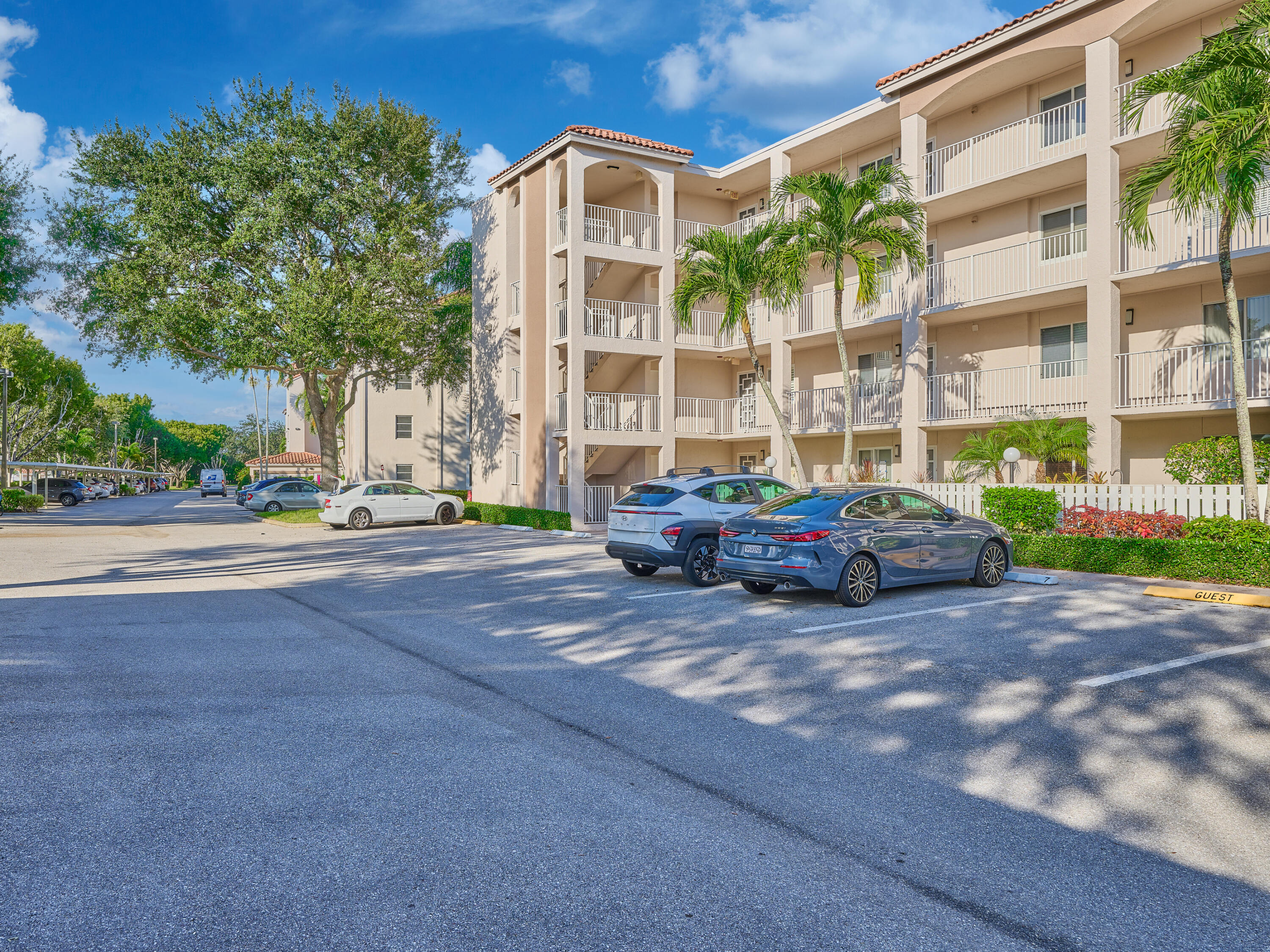 14112 Huntington Pointe Drive, Unit 401 Delray Beach, FL 33484 - Photo 3 of 49 a view of street with parked cars