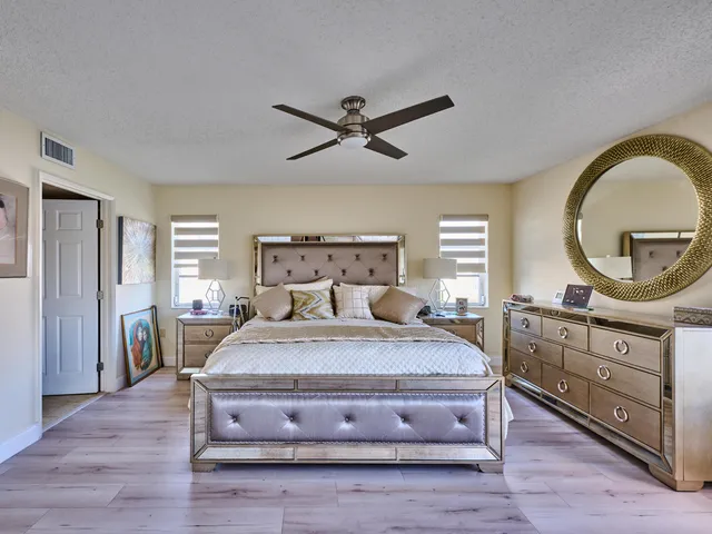 a bedroom with a bed and a dresser