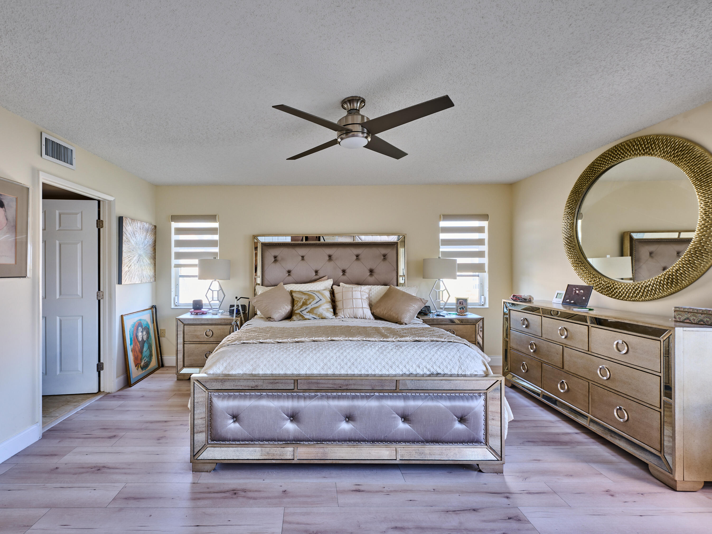 14112 Huntington Pointe Drive, Unit 401 Delray Beach, FL 33484 - Photo 36 of 49 a bedroom with a bed and a dresser