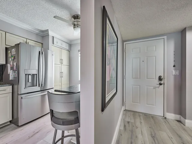a view of kitchen with furniture and wooden floor