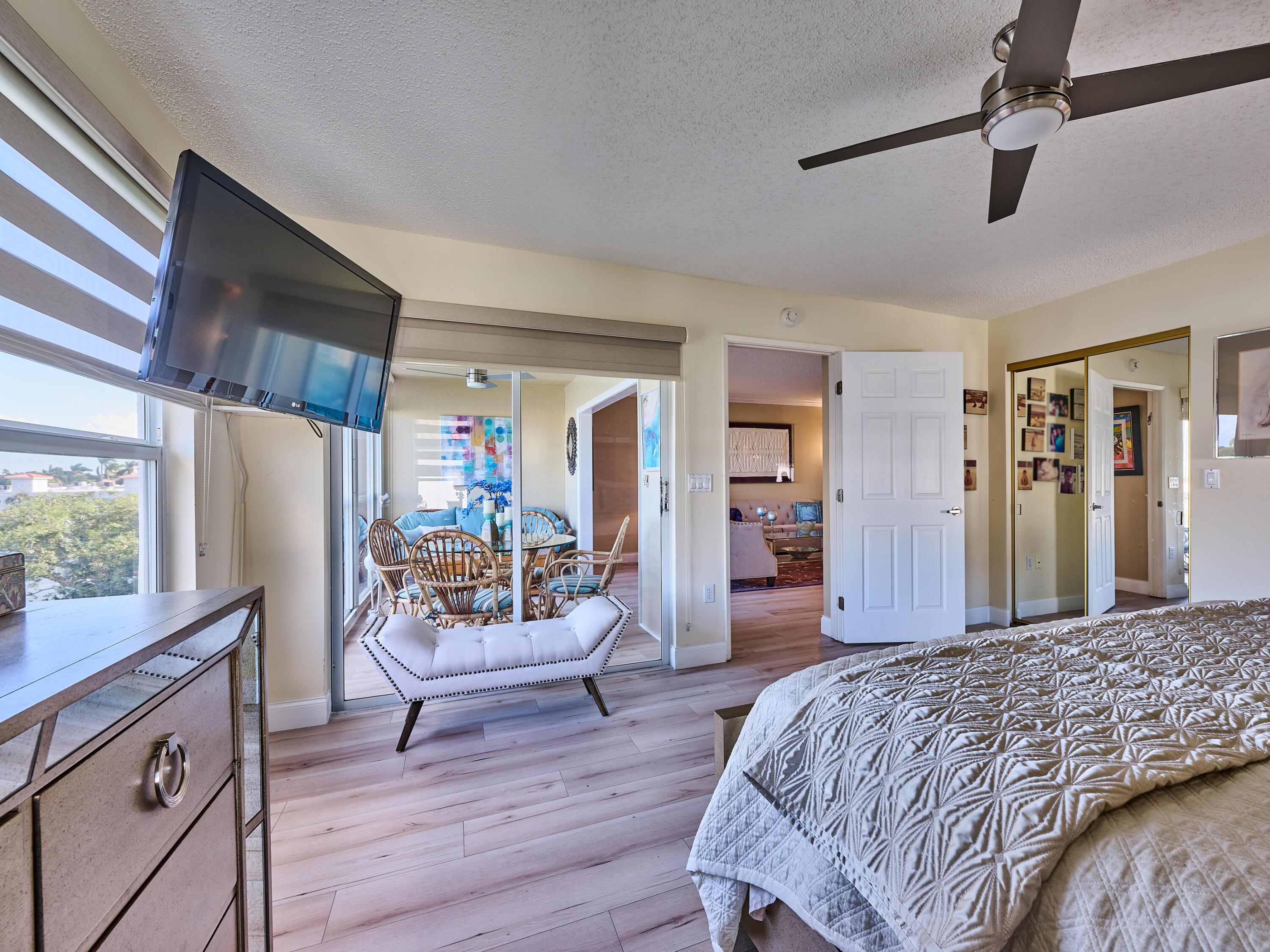 14112 Huntington Pointe Drive, Unit 401 Delray Beach, FL 33484 - Photo 41 of 49 a bedroom with a bed and wooden floor