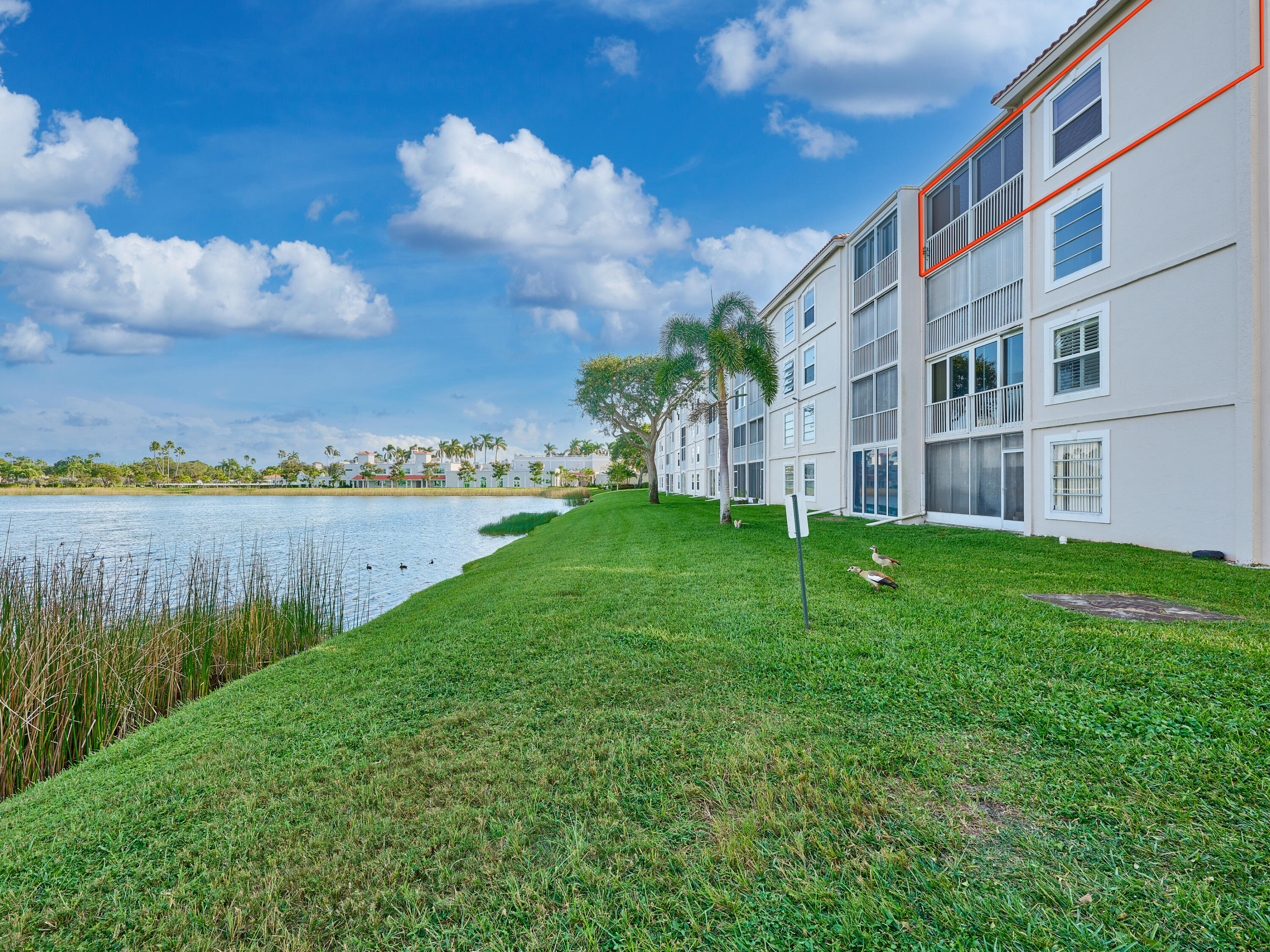 14112 Huntington Pointe Drive, Unit 401 Delray Beach, FL 33484 - Photo 46 of 49 a view of building with garden