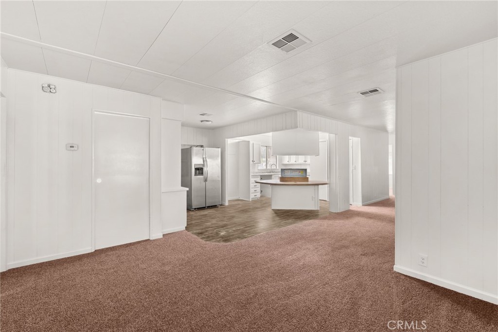 52102 Date Avenue Cabazon, CA 92230 - Photo 12 of 32 a view of a kitchen with a sink and a refrigerator