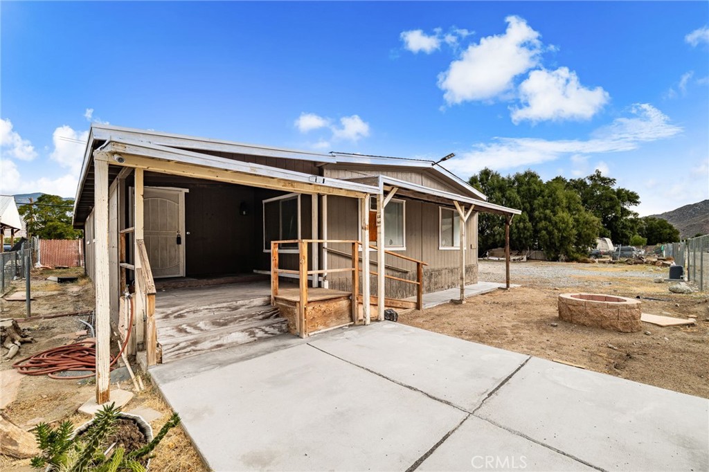 52102 Date Avenue Cabazon, CA 92230 - Photo 2 of 32 a view of a house with a patio