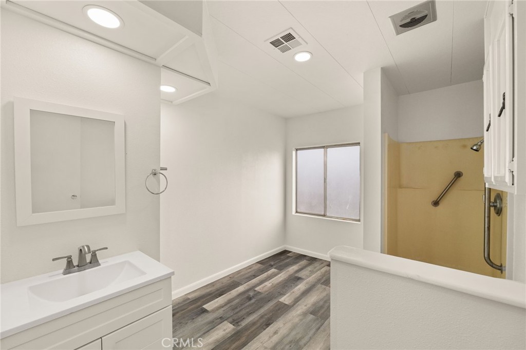 52102 Date Avenue Cabazon, CA 92230 - Photo 25 of 32 a bathroom with a sink and a mirror