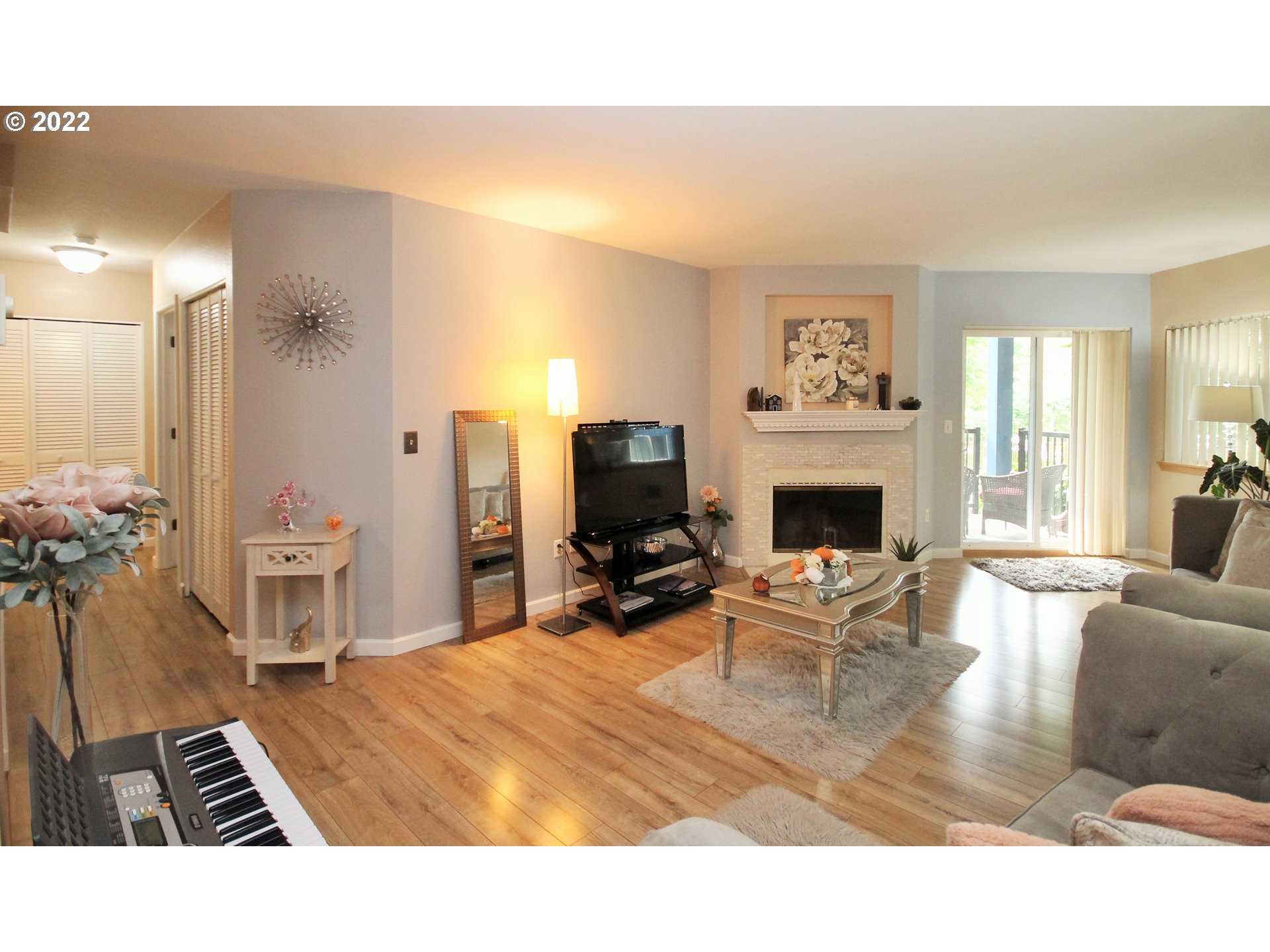 8720 Southwest Tualatin Road, Unit 107 Tualatin, OR 97062 - Photo 12 of 30 a living room with furniture and a fireplace