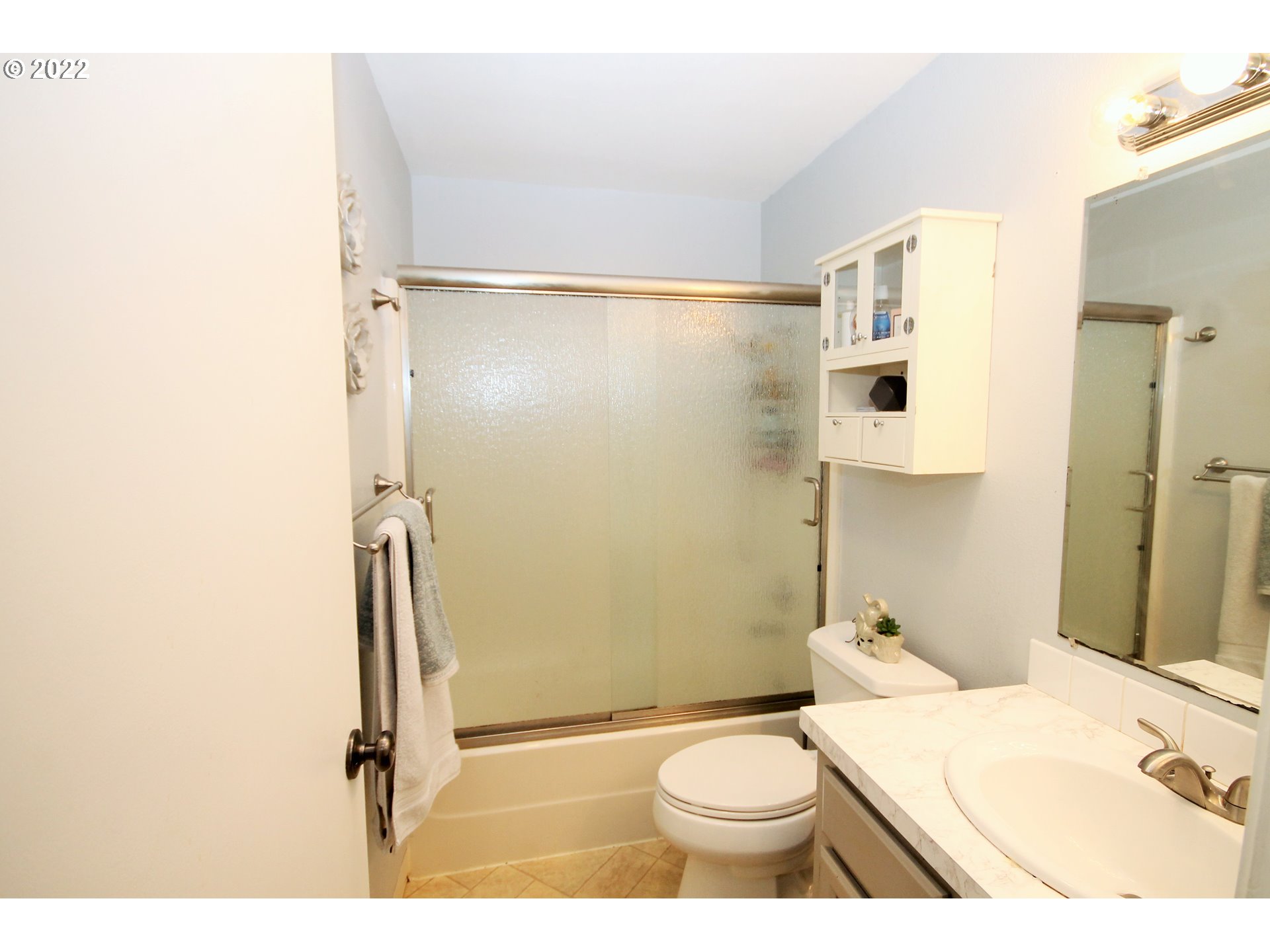 8720 Southwest Tualatin Road, Unit 107 Tualatin, OR 97062 - Photo 14 of 30 a bathroom with a sink toilet and shower