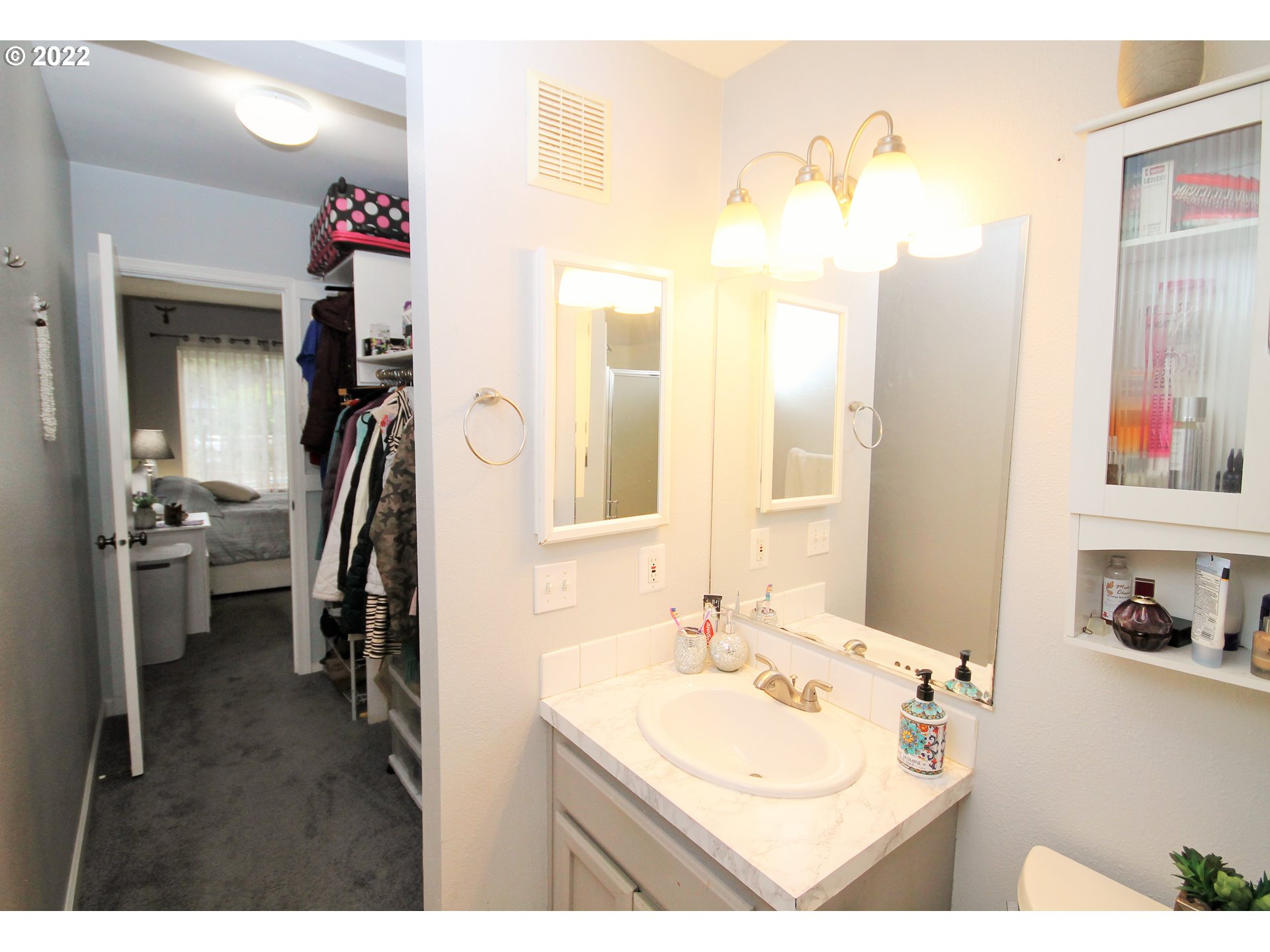 8720 Southwest Tualatin Road, Unit 107 Tualatin, OR 97062 - Photo 22 of 30 a bathroom with a sink vanity and a mirror