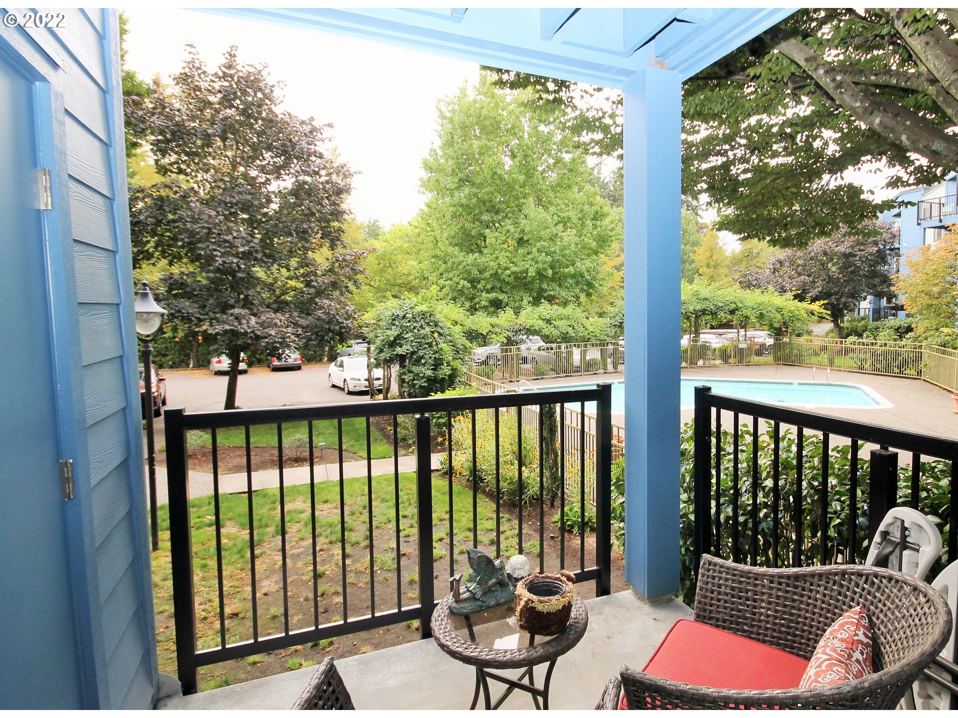 8720 Southwest Tualatin Road, Unit 107 Tualatin, OR 97062 - Photo 26 of 30 a balcony with furniture and wooden floor