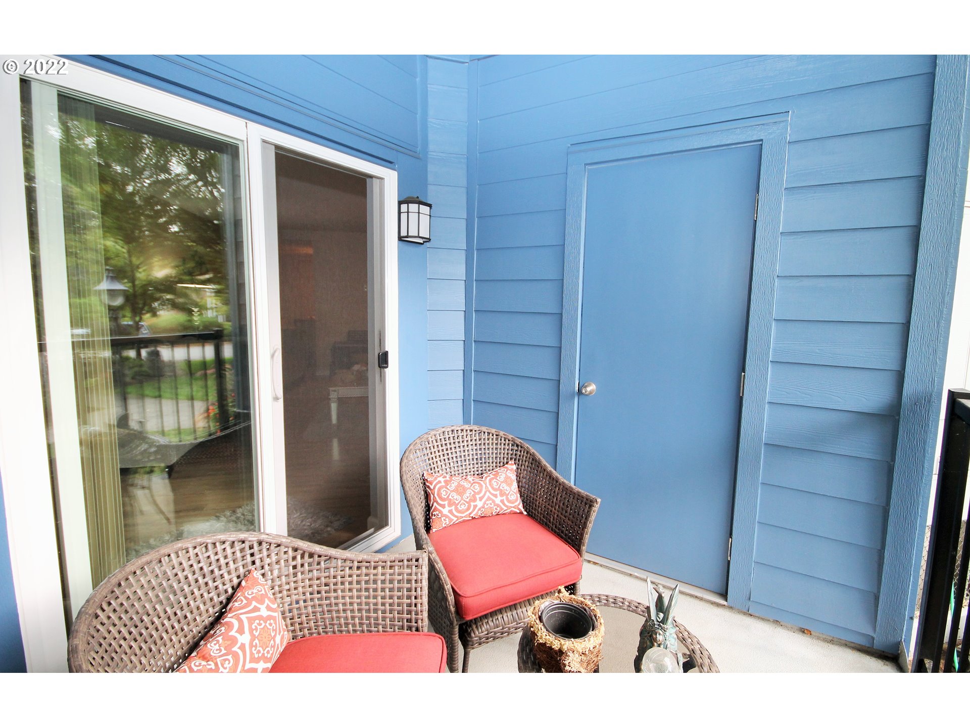 8720 Southwest Tualatin Road, Unit 107 Tualatin, OR 97062 - Photo 29 of 30 a bedroom with a bed and wooden floor