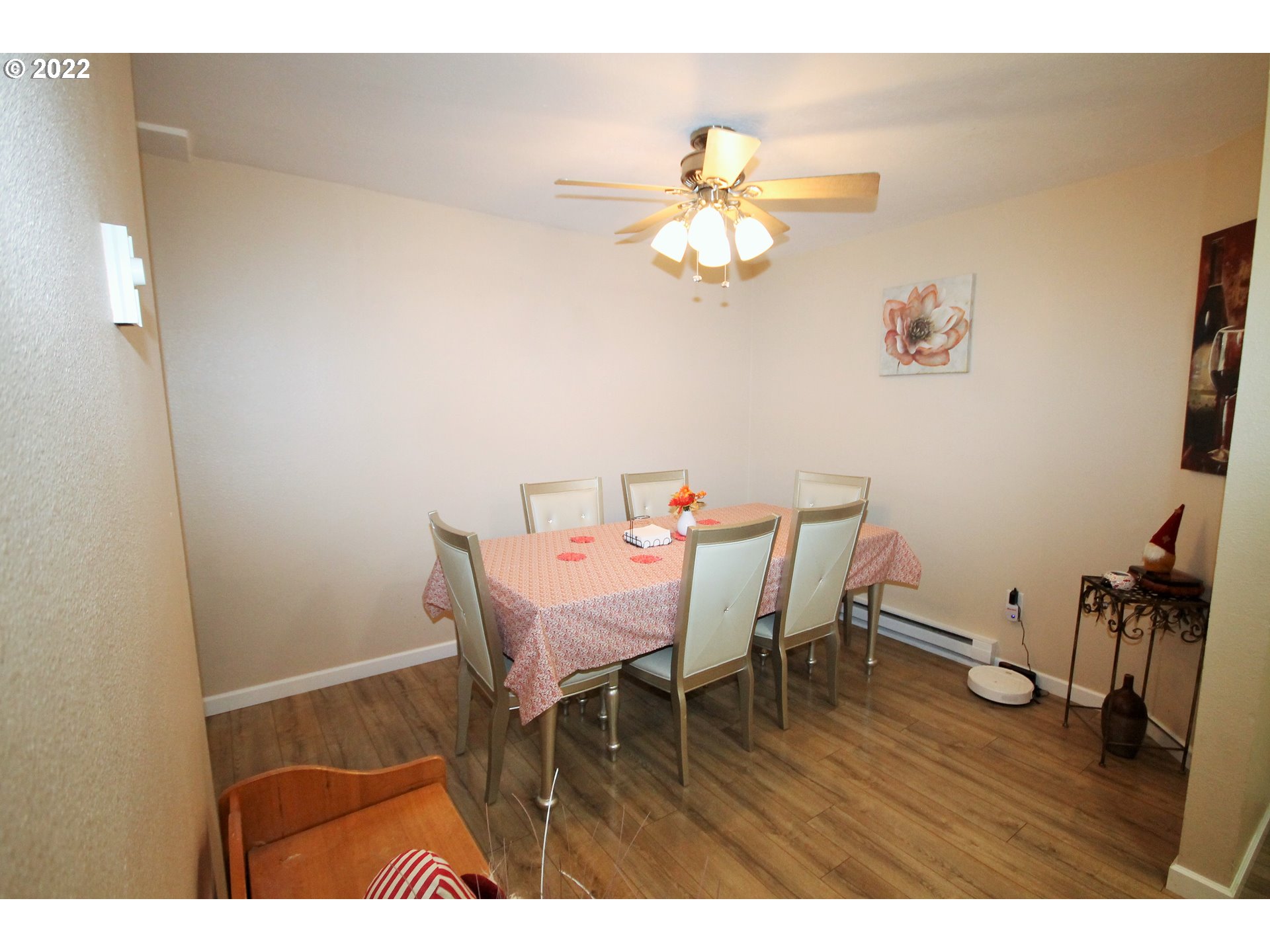 8720 Southwest Tualatin Road, Unit 107 Tualatin, OR 97062 - Photo 6 of 30 a view of a dining room with furniture and wooden floor