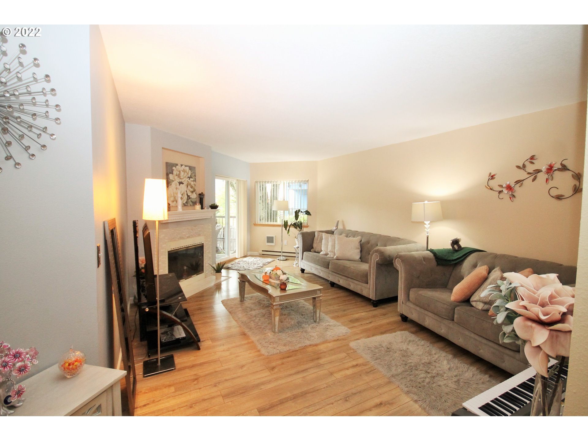 8720 Southwest Tualatin Road, Unit 107 Tualatin, OR 97062 - Photo 10 of 30 a living room with furniture and a fireplace