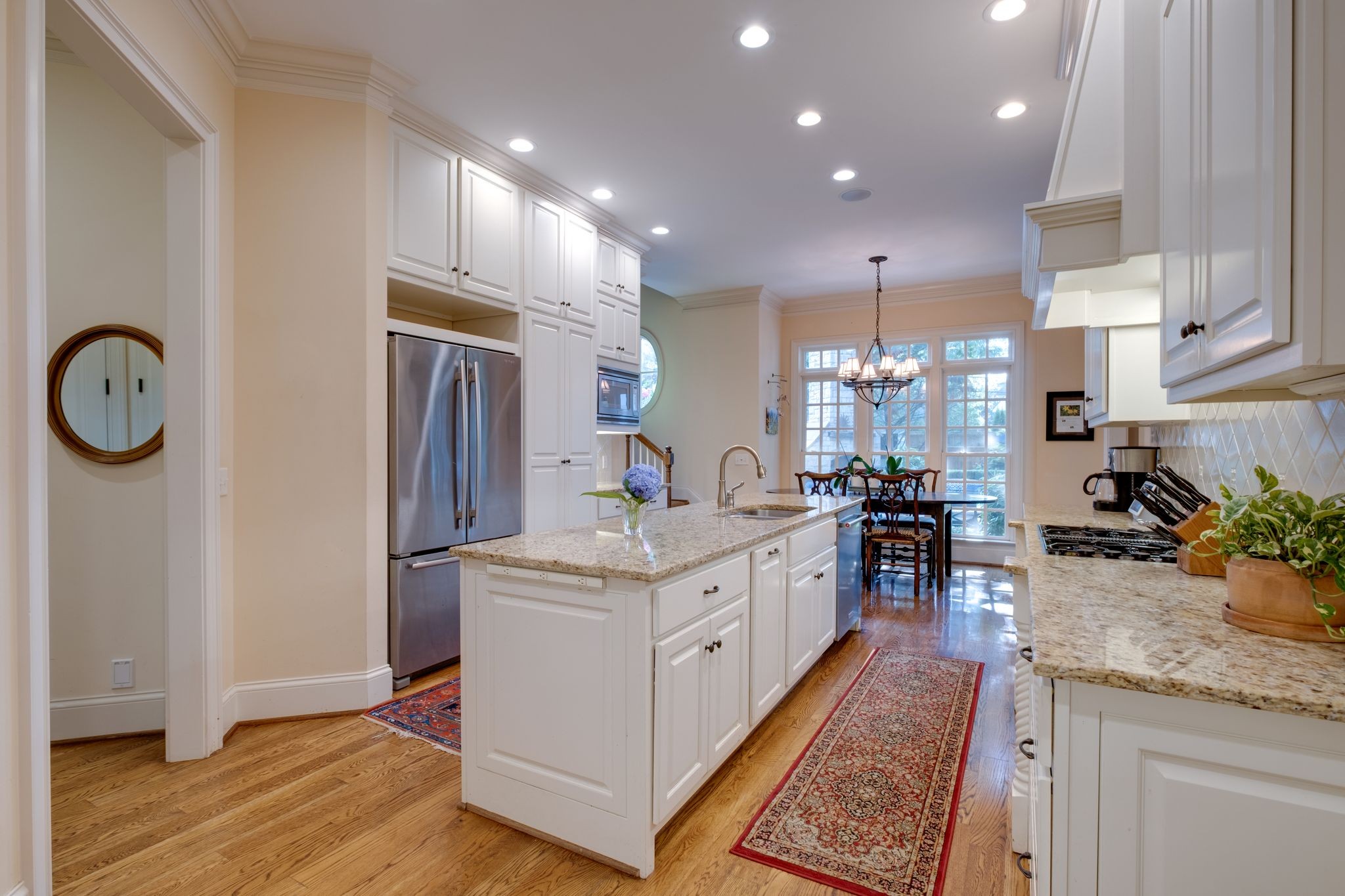 217 Page Road Nashville, TN 37205 - Photo 20 of 61 a large kitchen with kitchen island a sink stainless steel appliances and cabinets