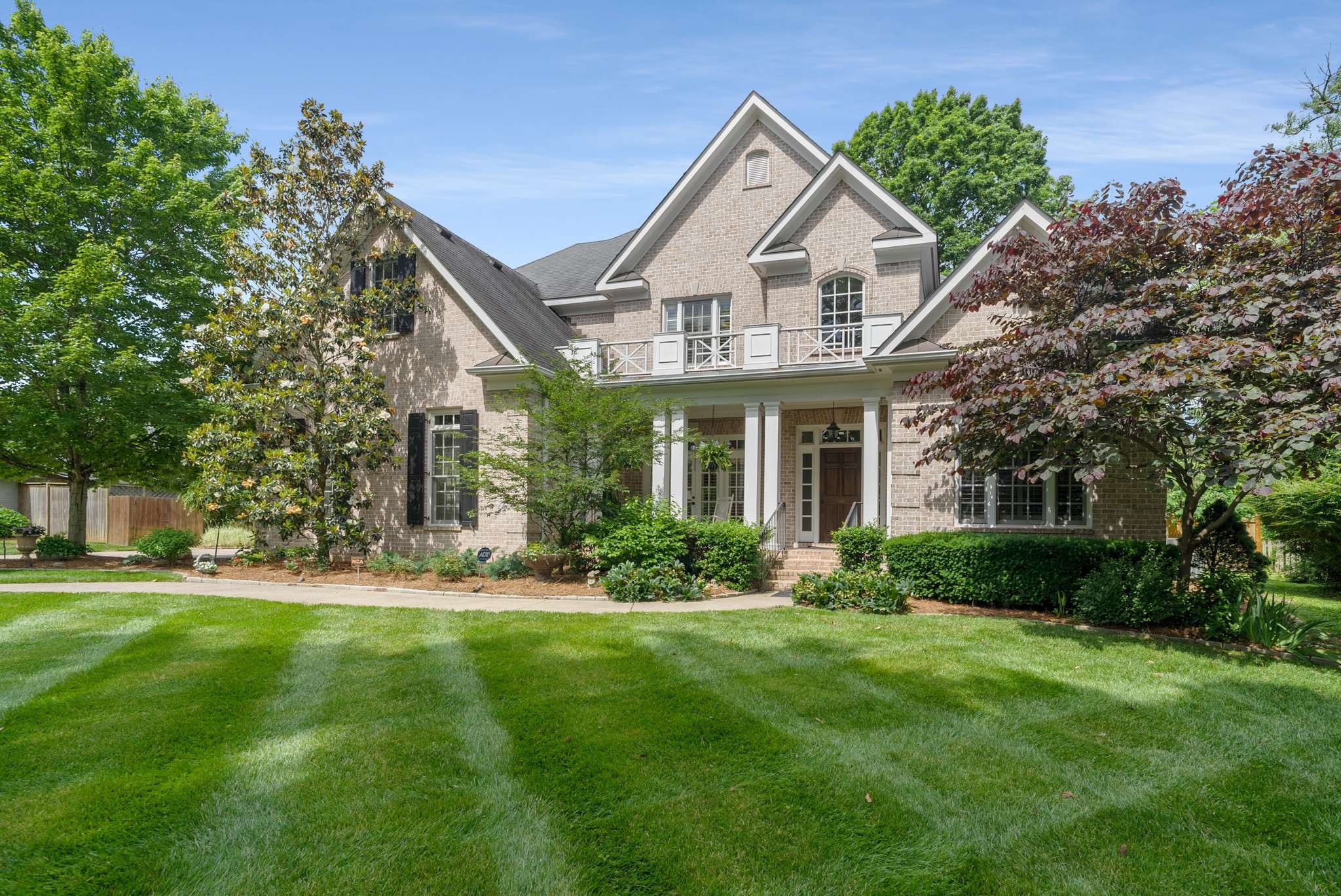 217 Page Road Nashville, TN 37205 - Photo 2 of 61 a front view of a house with a yard