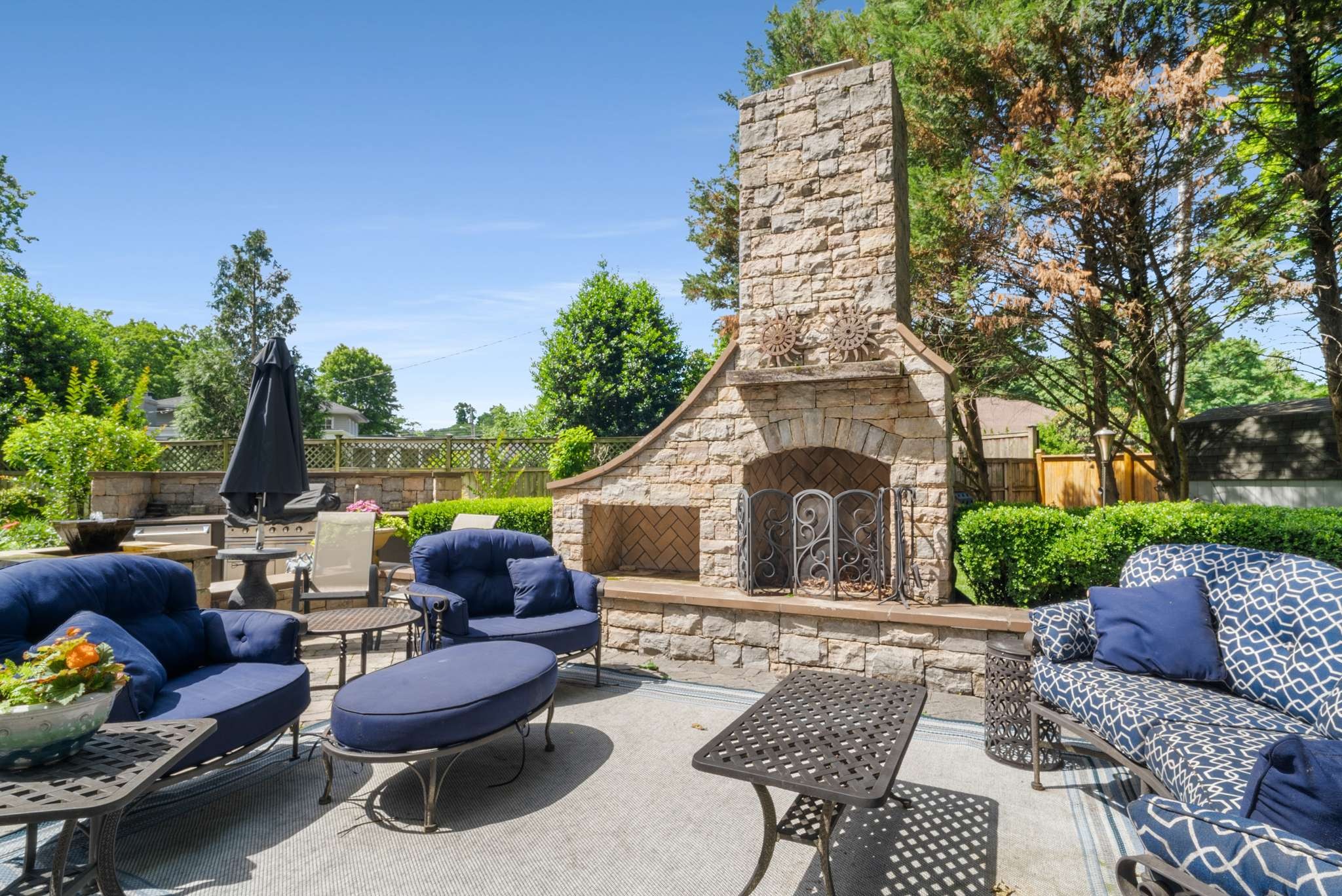 217 Page Road Nashville, TN 37205 - Photo 46 of 61 a view of a patio with couches table and chairs and potted plants