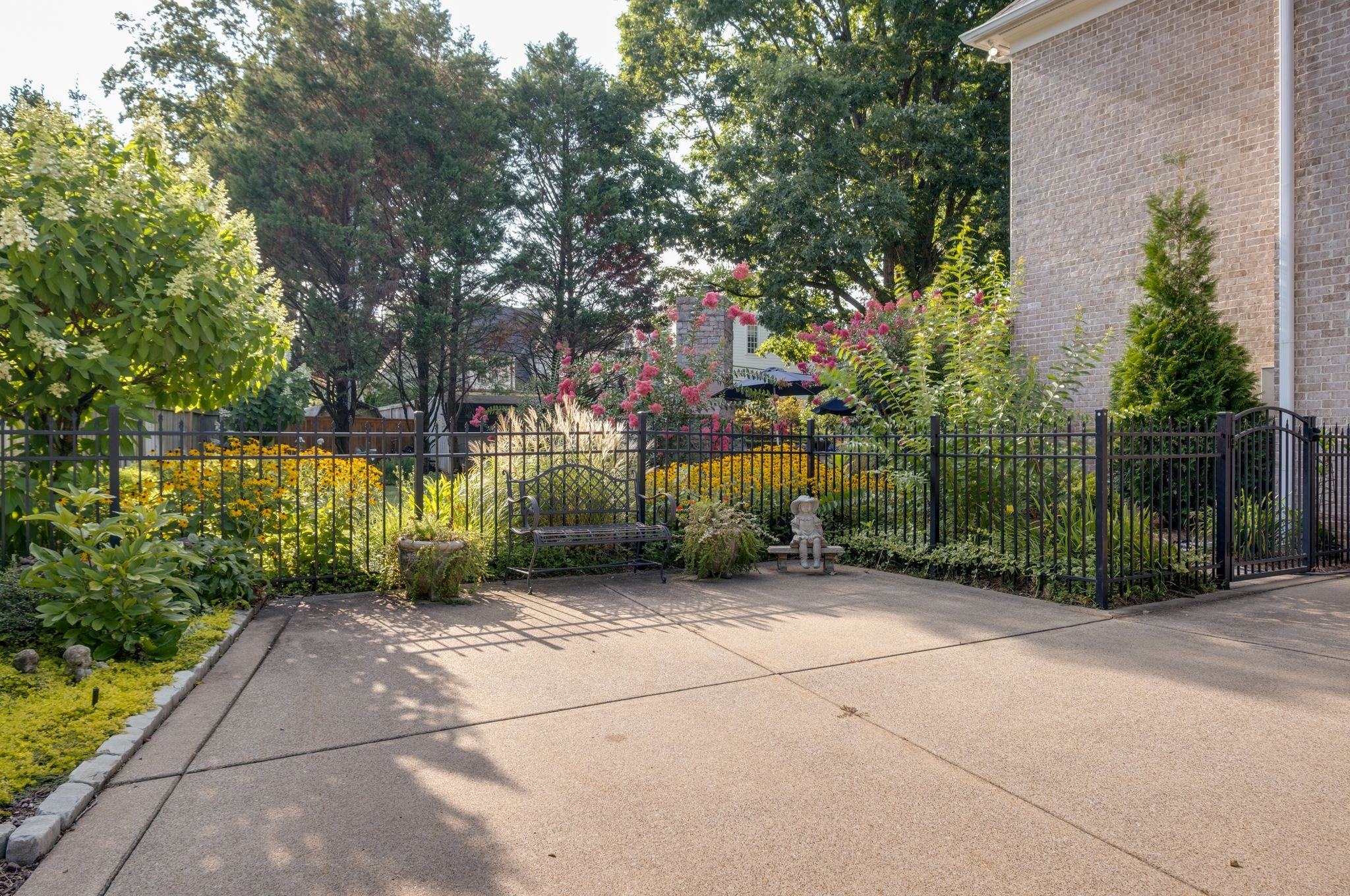 217 Page Road Nashville, TN 37205 - Photo 49 of 61 a view of a park with plants and a bench