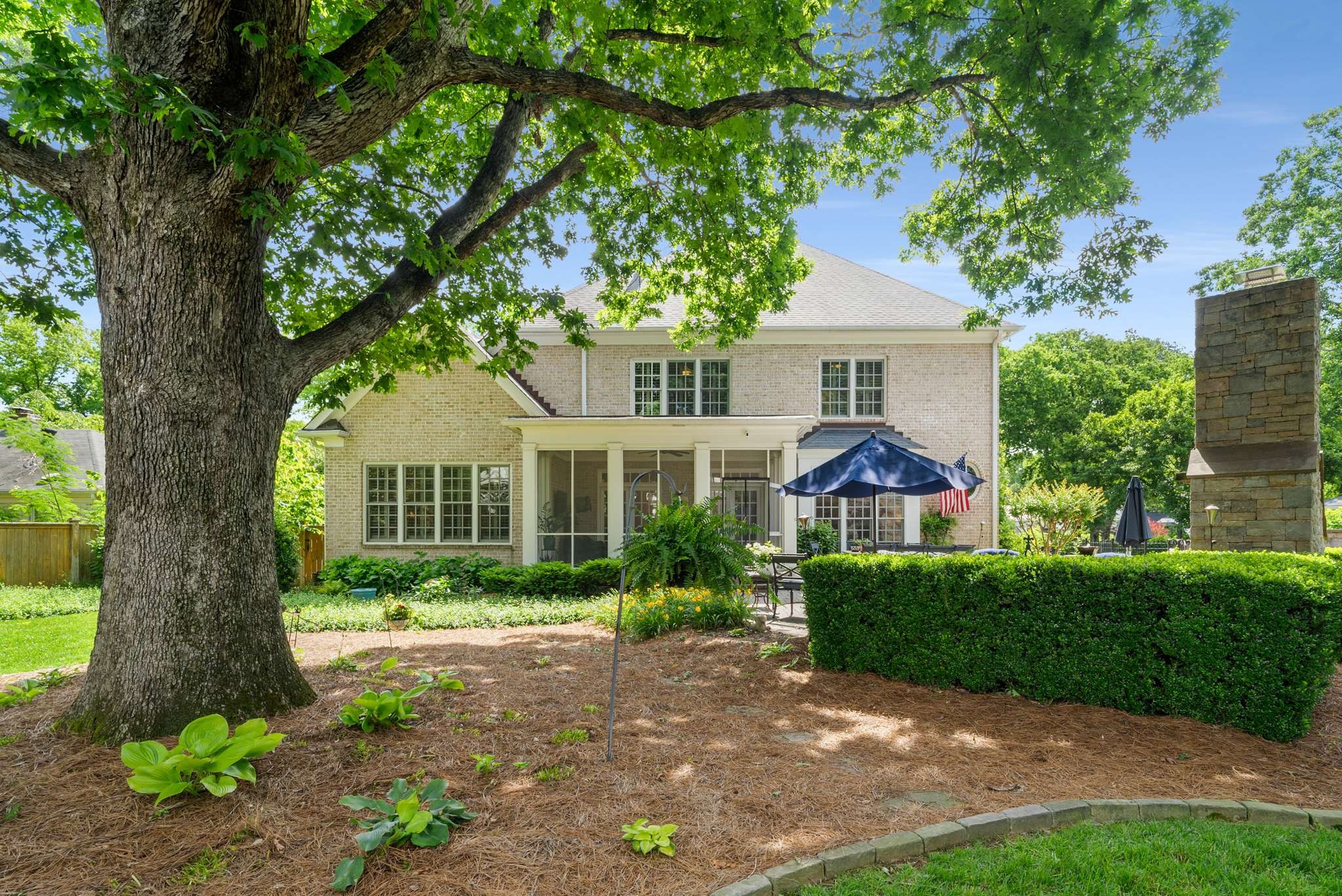 217 Page Road Nashville, TN 37205 - Photo 52 of 61 a front view of a house with a garden