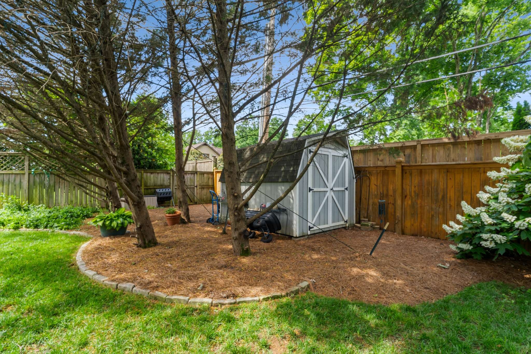 217 Page Road Nashville, TN 37205 - Photo 56 of 61 a backyard of a house with lots of green space