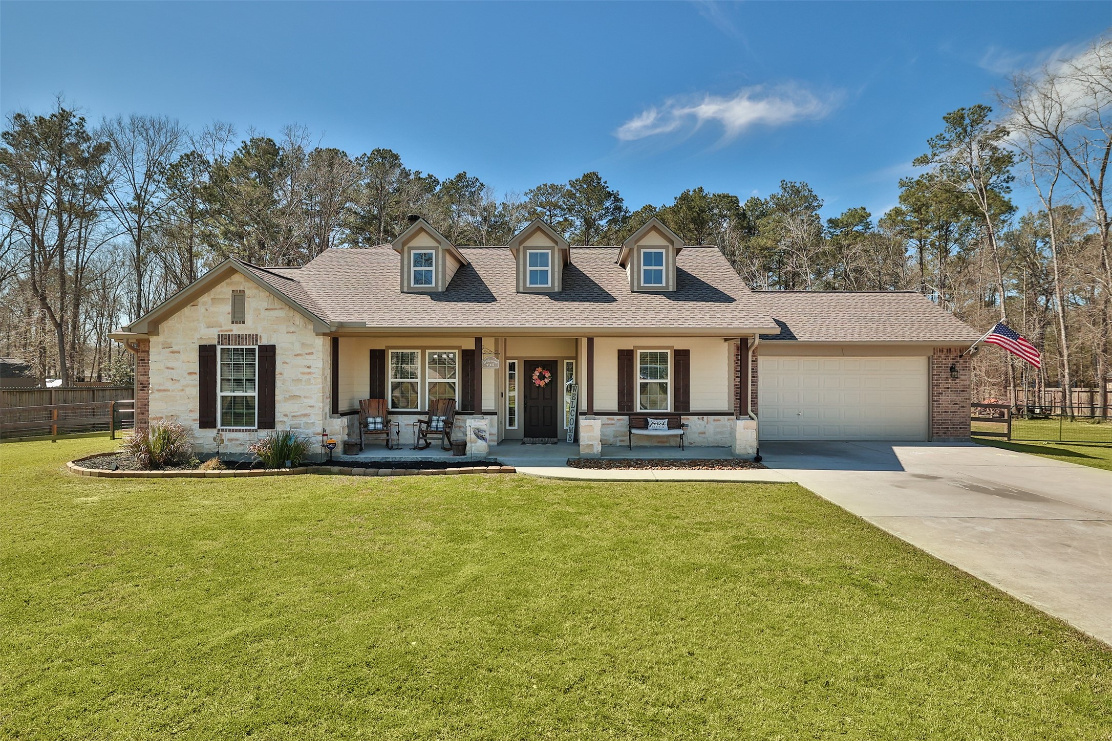 a front view of a house with swimming pool having outdoor seating