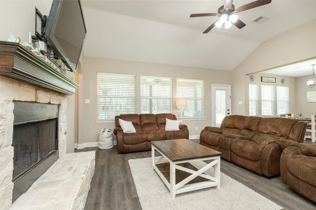 a living room with furniture and a fireplace