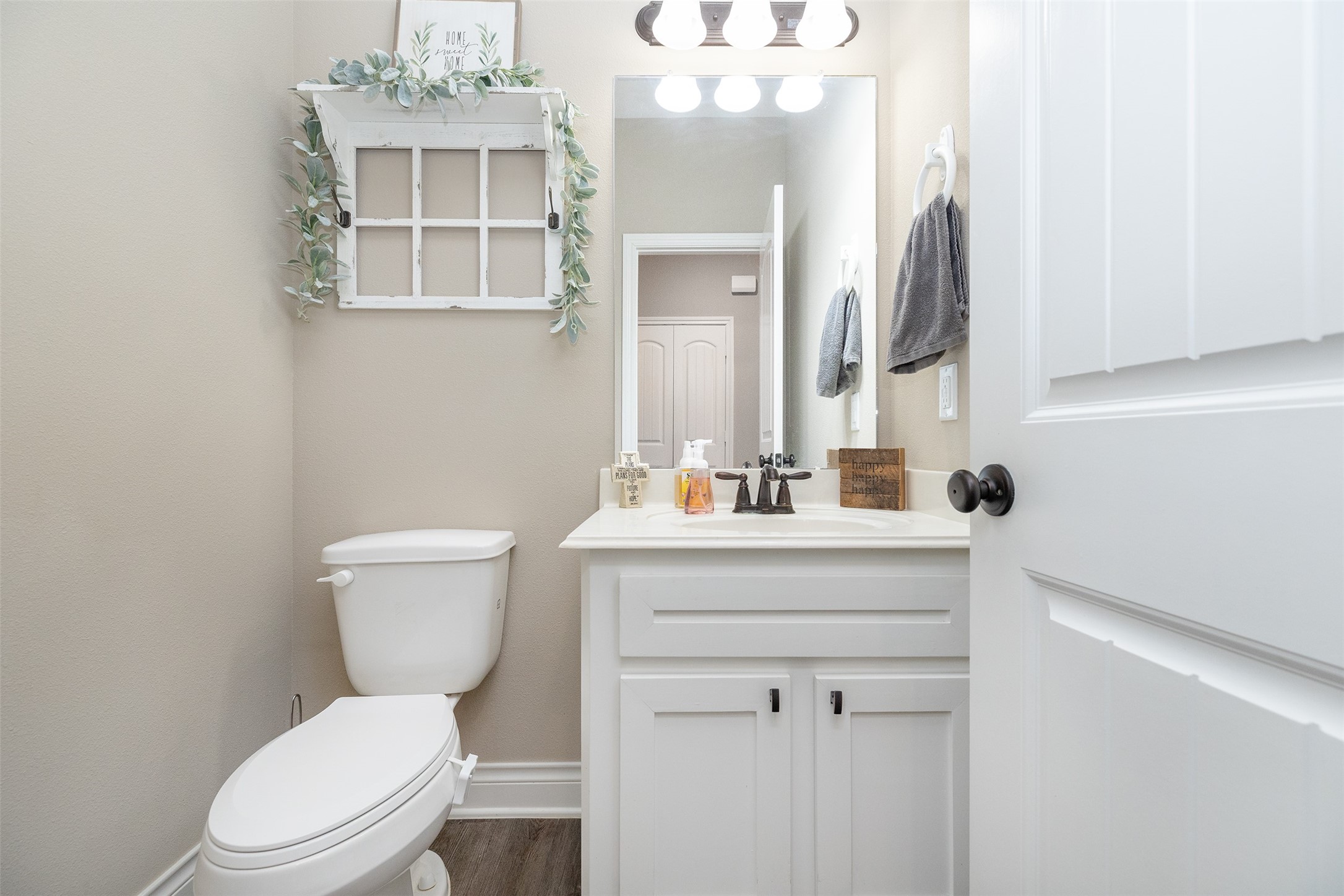 27627 Concho Drive Splendora, TX 77372 - Photo 20 of 41 a bathroom with a toilet a sink and mirror