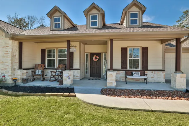 a front view of a house with swimming pool
