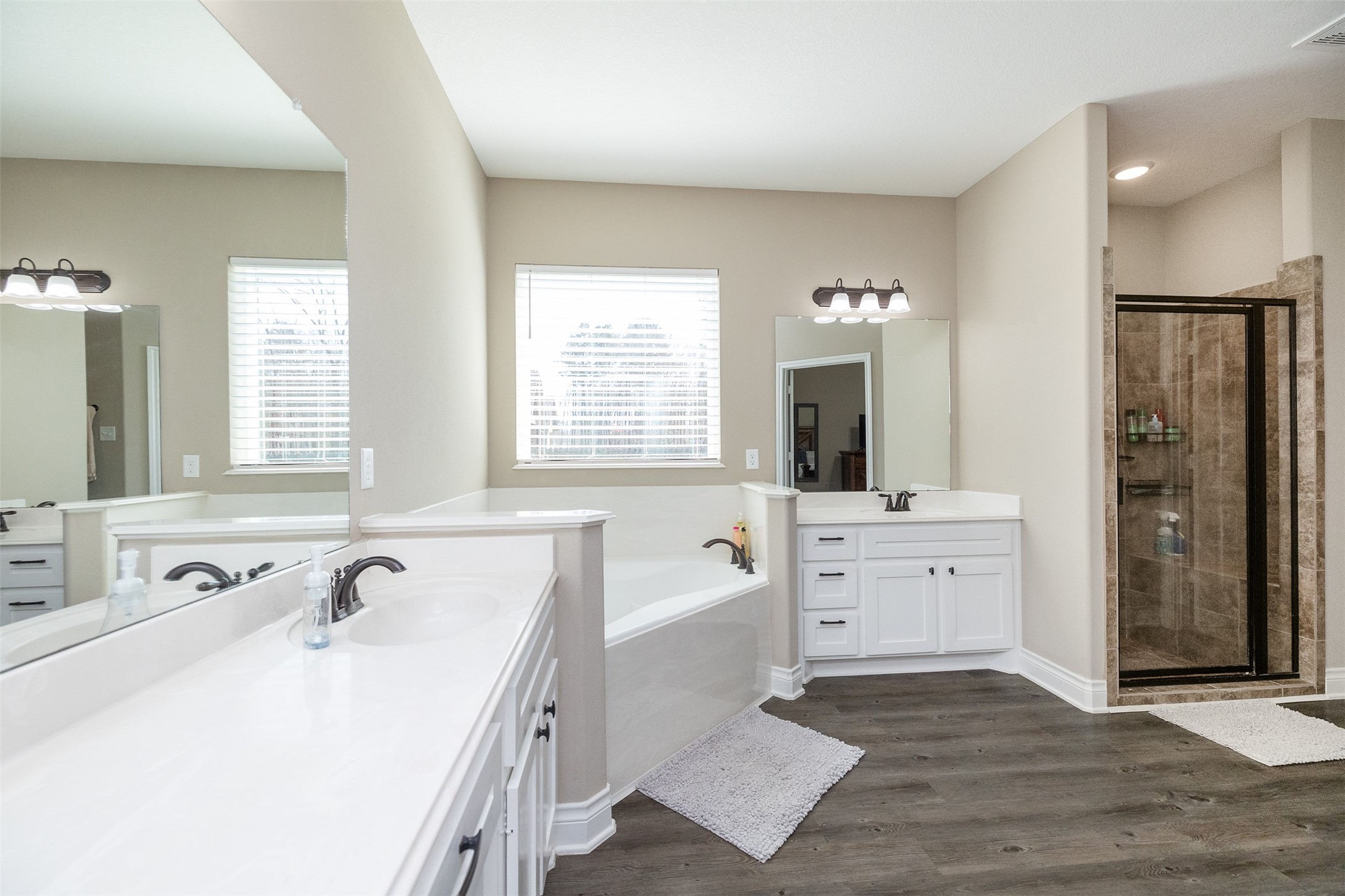 27627 Concho Drive Splendora, TX 77372 - Photo 23 of 41 a spacious bathroom with a tub sink and mirror