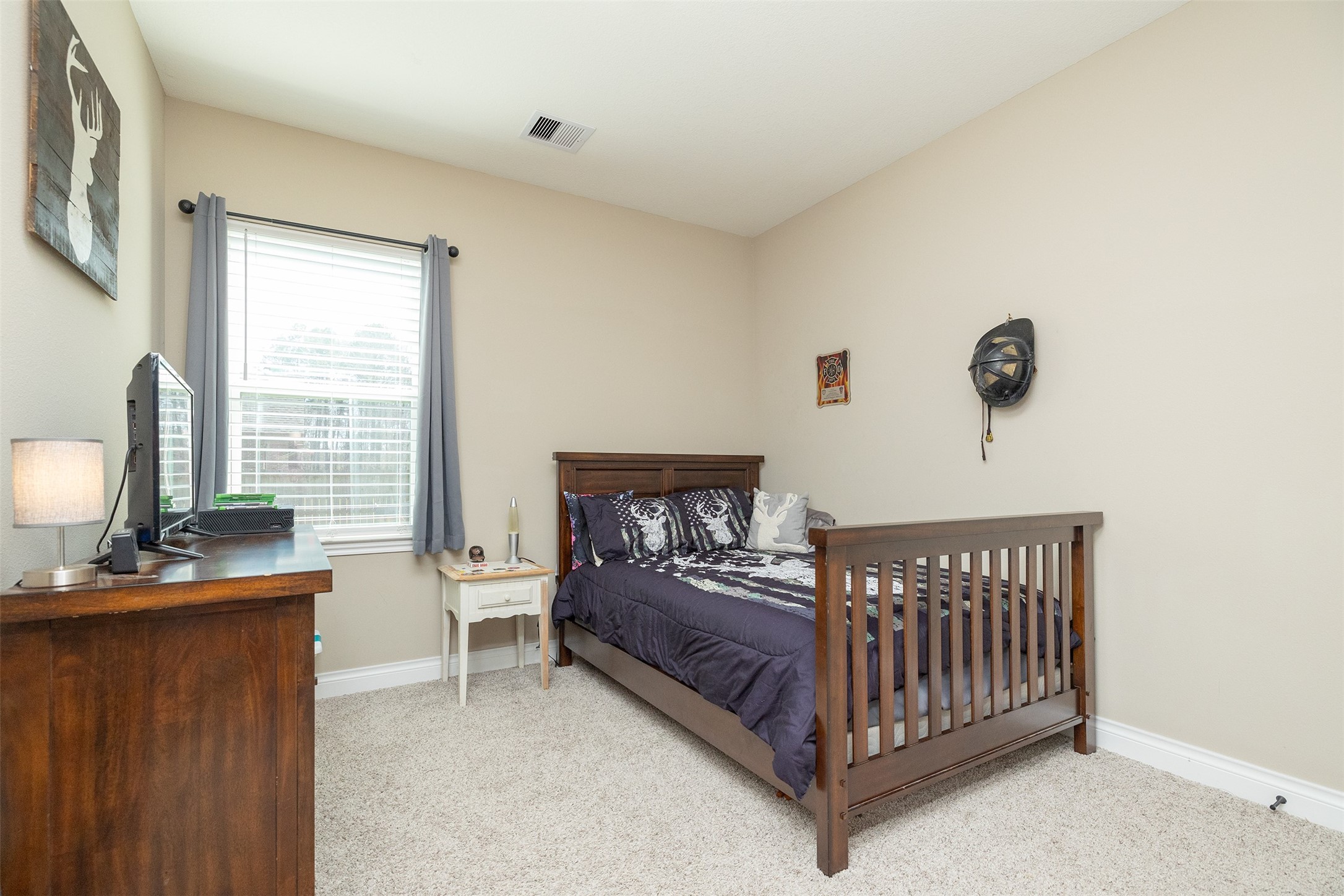 27627 Concho Drive Splendora, TX 77372 - Photo 29 of 41 a bedroom with a bed and a window