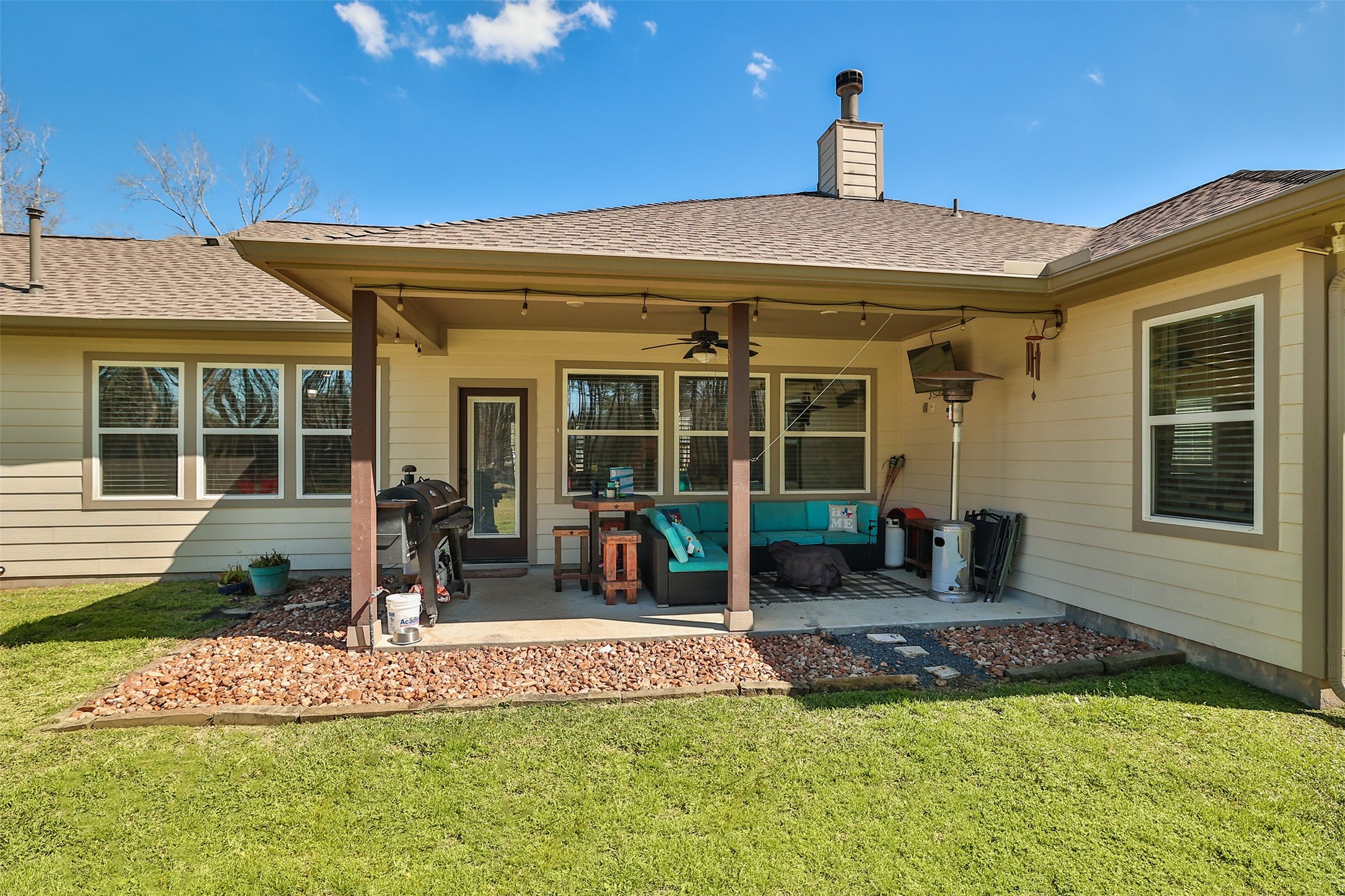 27627 Concho Drive Splendora, TX 77372 - Photo 30 of 41 a front view of a house with a yard garden and outdoor seating