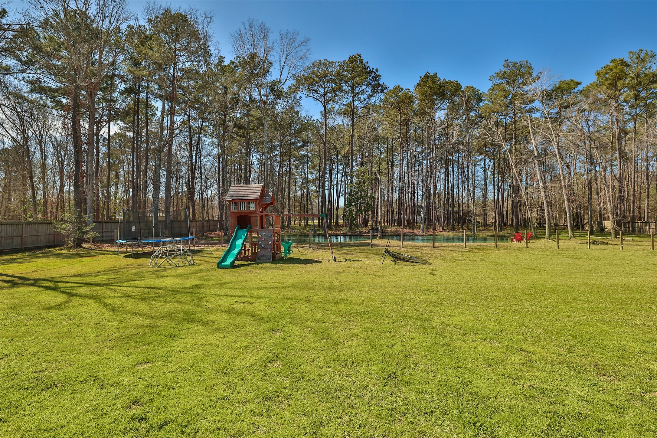 27627 Concho Drive Splendora, TX 77372 - Photo 32 of 41 a swimming pool with outdoor seating and yard