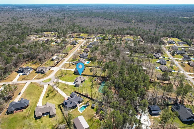 an aerial view of residential house and outdoor space