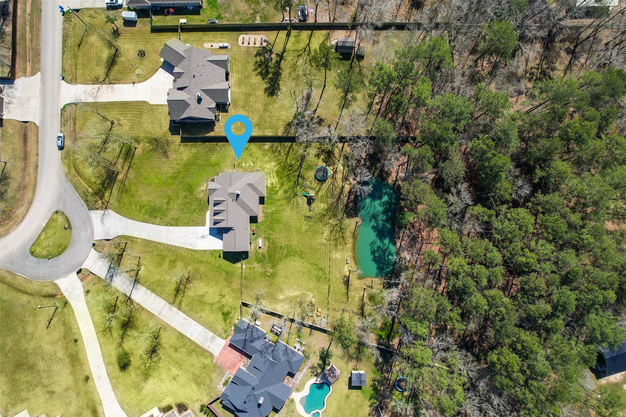 27627 Concho Drive Splendora, TX 77372 - Photo 39 of 41 an aerial view of a house with a swimming pool