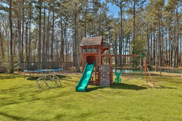 swimming pool with outdoor seating and yard