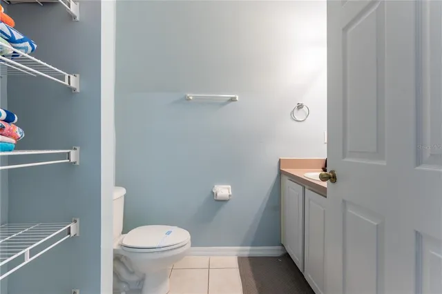 a bedroom with a bed and a flat tv screen