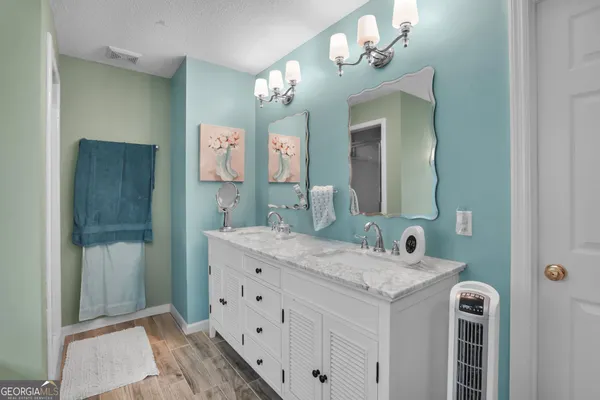 a bathroom with a bathtub and window