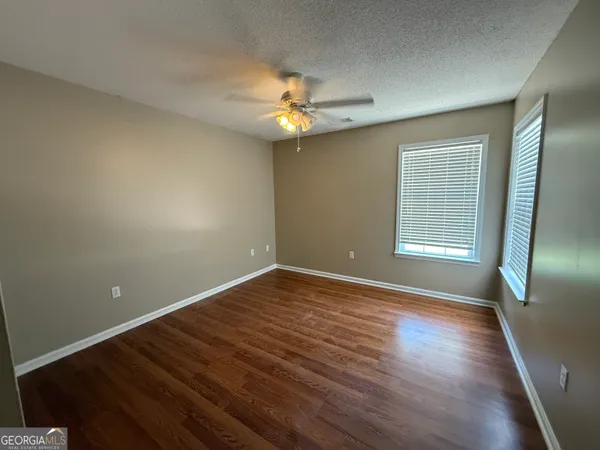 a view of a livingroom with wooden floor