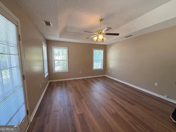 a view of room with cabinets