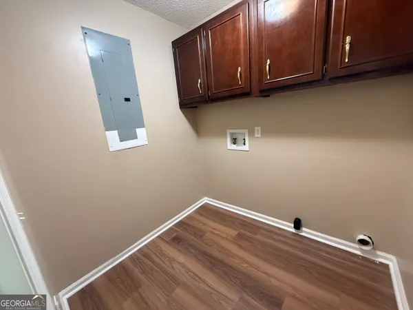 a bathroom with a granite countertop sink a mirror and shower