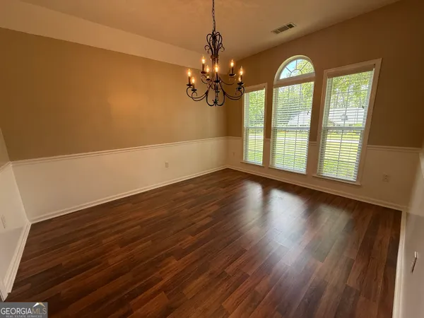 a kitchen with a sink cabinets and appliances