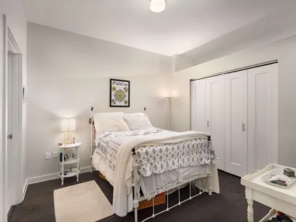 a bedroom with a bed and a table in it