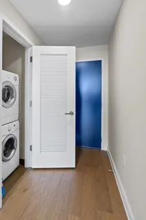 a view of a hallway with washer and dryer