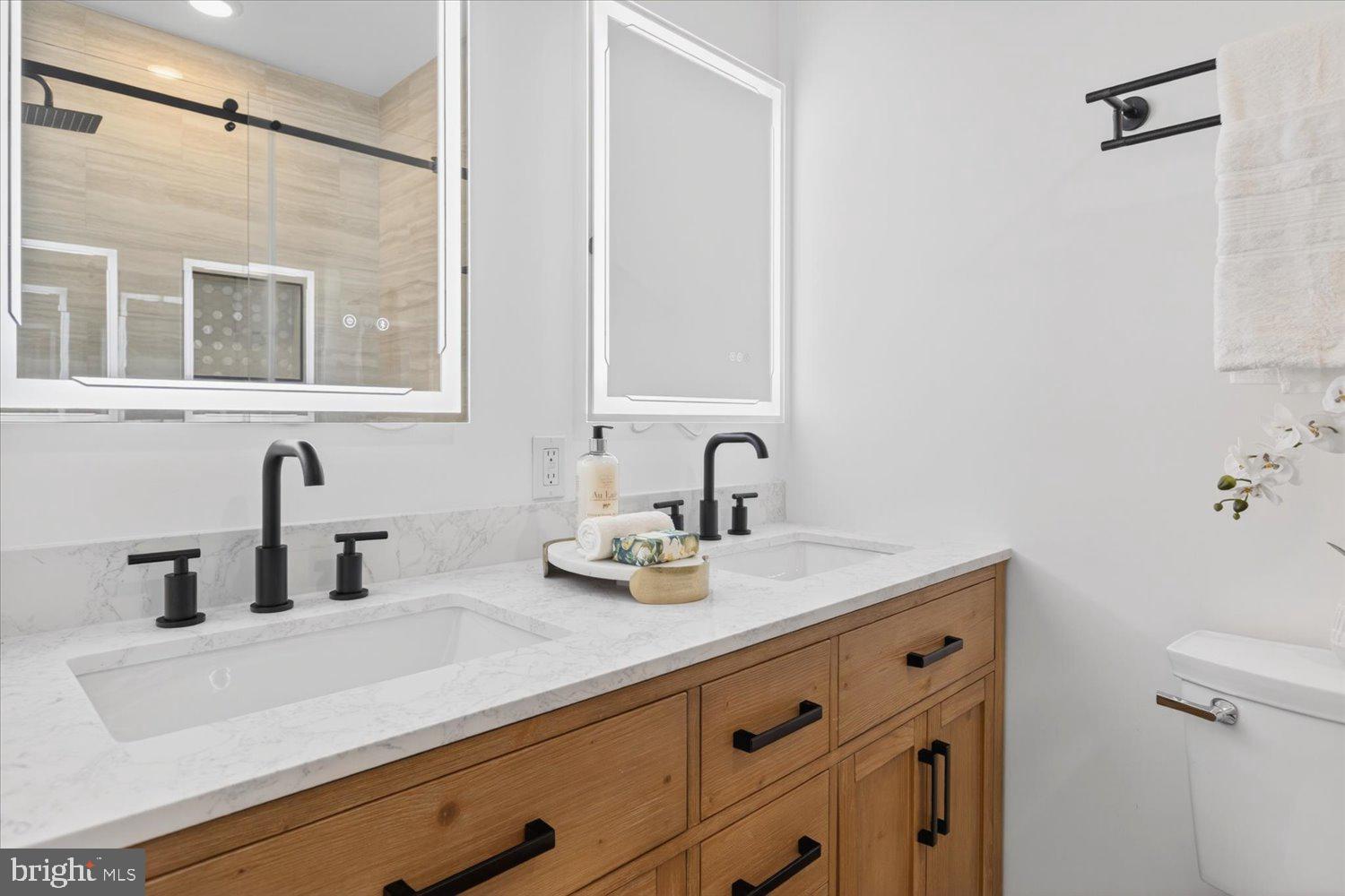 1704 Independence Avenue Southeast Washington, DC 20003 - Photo 37 of 73 Hi-tech double mirrors in the primary bathroom.