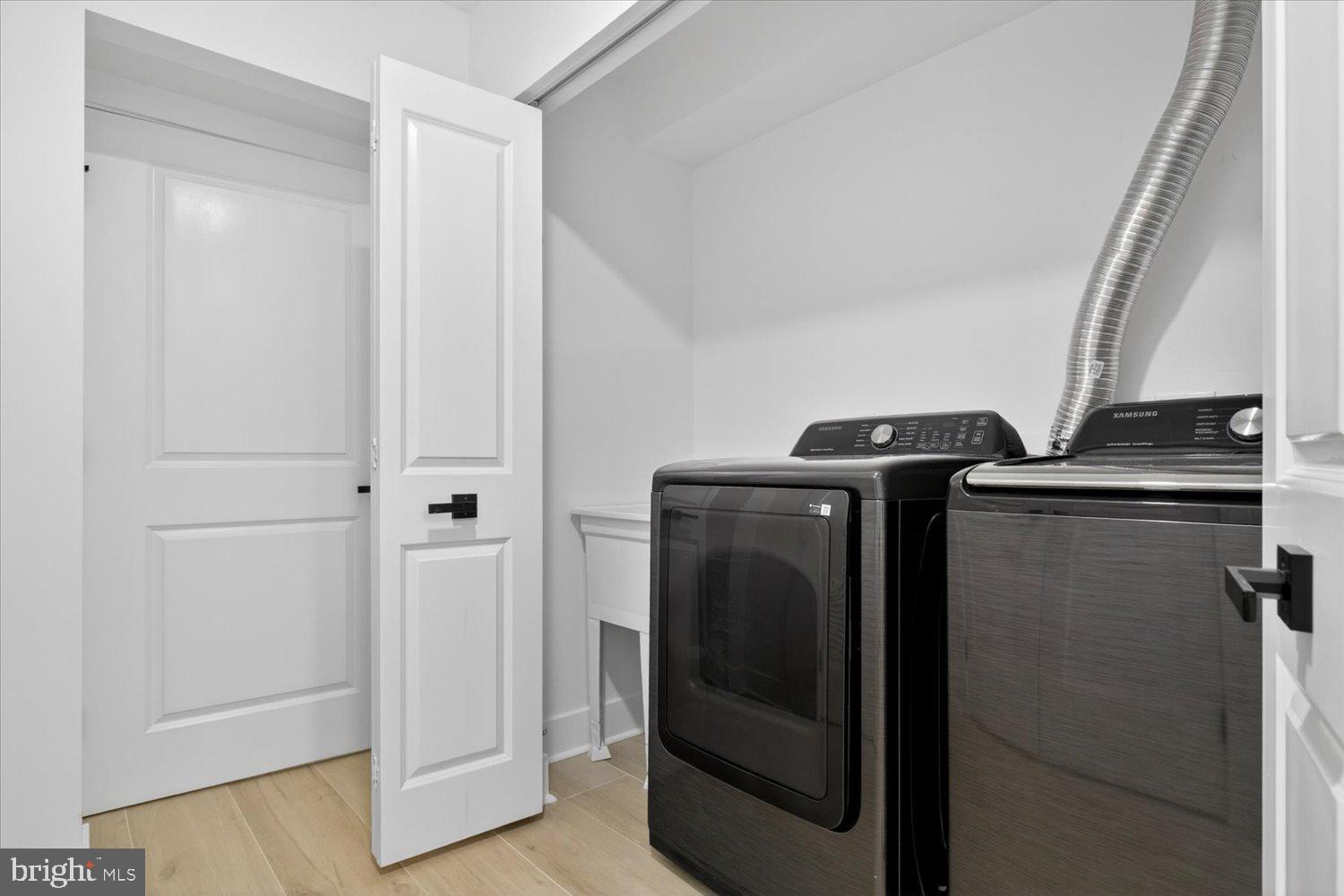 1704 Independence Avenue Southeast Washington, DC 20003 - Photo 54 of 73 Sleek laundry space with modern appliances.