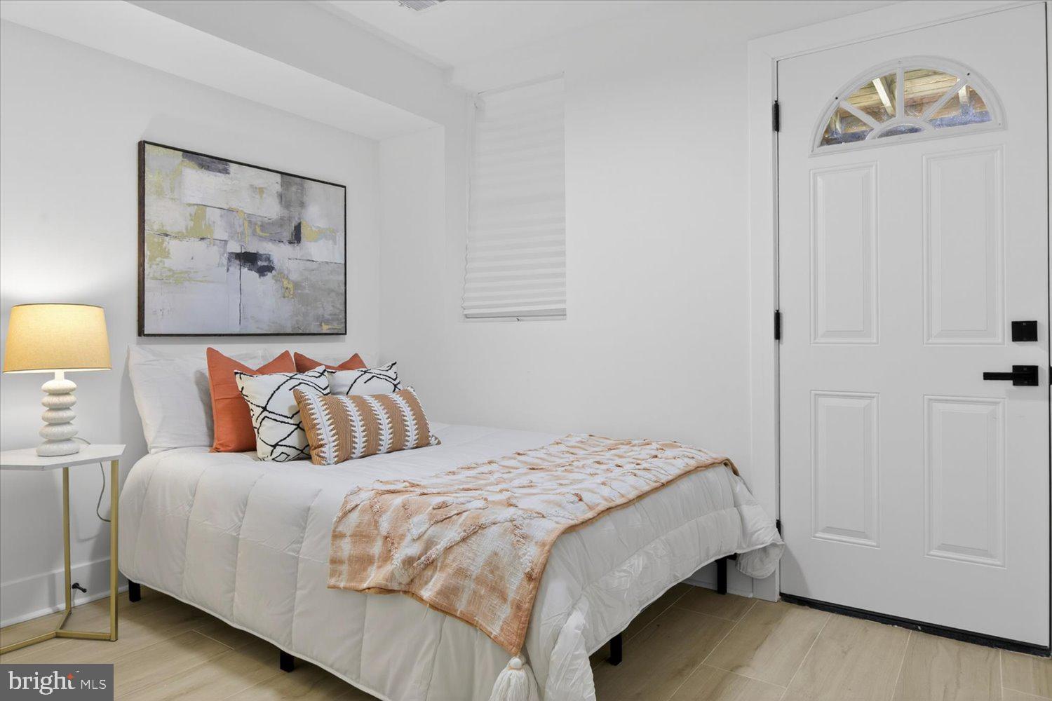 1704 Independence Avenue Southeast Washington, DC 20003 - Photo 56 of 67 a bedroom with a bed and a painting on the wall
