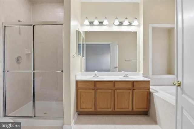 a white bath tub sitting next to a white sink